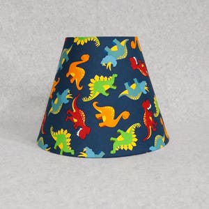 Dinosaur lamp shade.  Shades are 9.5" x 5" x 7" tall