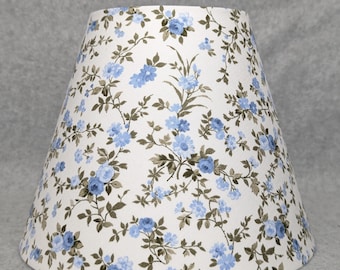 Blue Flowers on white lamp shade.   Blue, green, white.  Plants.  Flowers. Green leaves.  Shades are 9.5" x 5" x 7" tall