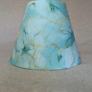 Green, teal, gold swirl lamp shade.  Geode.  Shade is 9.5 wide at the bottom, 5" wide at the top and 7" tall.
