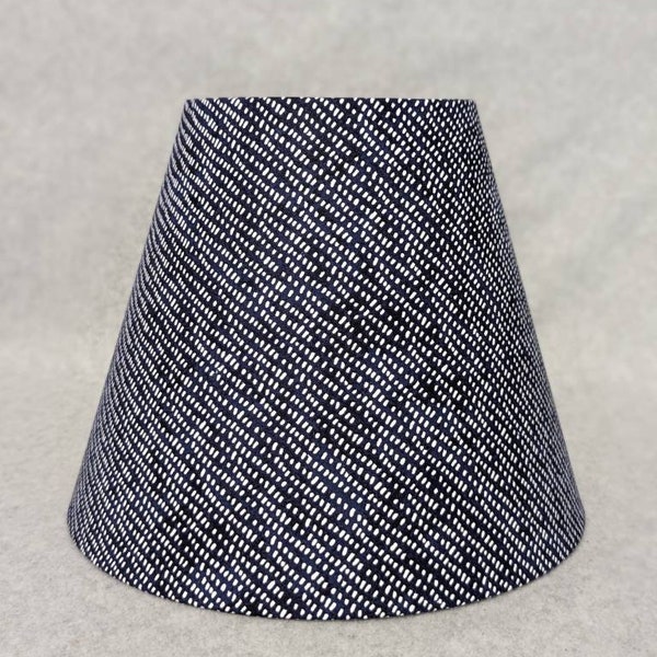 Blue with white dots lamp shade. Blue and white.  Shade is 9.5" wide at bottom, 5" wide at the top and 7" tall