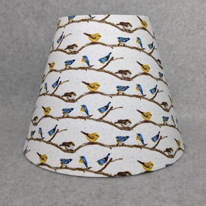 Birds on limbs lamp shade.   Blue Jay, Cardinal, Finch. Trees.  Flowers. Shades are 9.5" x 5" x 7" tall