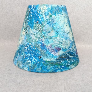 Blue, teal, green white splatter painting lamp shade.  Abstract. Alcohol. Shade is 9.5 wide at the bottom, 5" wide at the top and 7" tall