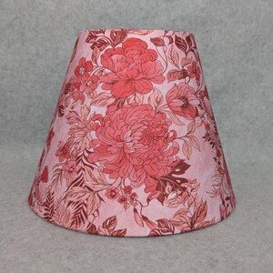 Pink and red blooming flowers lamp shade.  Pink background.  Bloom.  Vibrant.   Shades are 9.5" x 5" x 7" tall