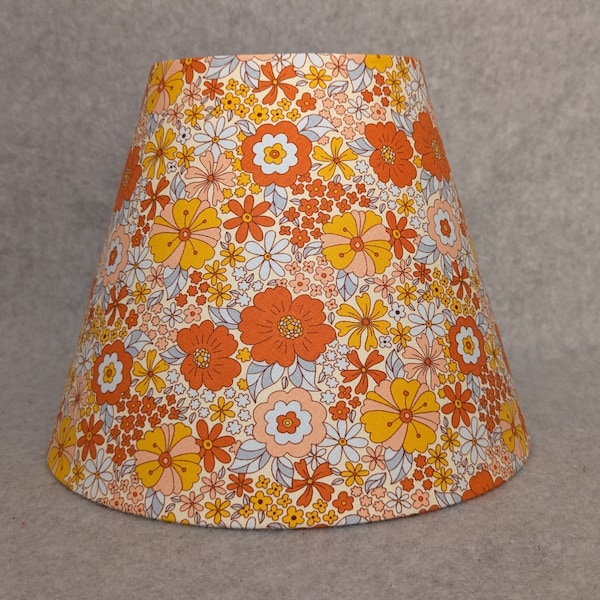 Orange Hippie flowers lamp shade.  Cream background.  Flower.  Yellow, teal.  Colorful.  Plants.  Flowers. Shades are 9.5" x 5" x 7" tall