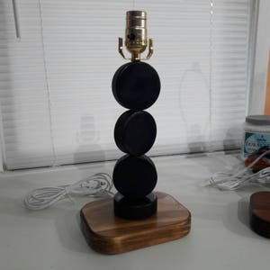 Hockey lamp , pucks (shade sold separately) can now be personalized with a name and/or #.  Hockey puck lamp.  Shades are 9.5&quot; x 5&quot; x 7&quot; tall