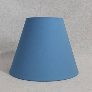 Light Blue lamp shade.  Solid blue.  Shade is 9.5" wide at the bottom, 5" wide at the top and 7" tall