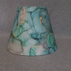 Green, teal, gold swirl lamp shade.  Geode.  Shade is 9.5 wide at the bottom, 5" wide at the top and 7" tall.