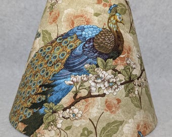 Peacock lamp shade.  More solid look.  Feathers.  Bird.  Green, blue, gold.  Shade is 9.5 wide at the bottom, 5" wide at the top and 7" tall