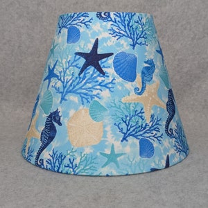 Seahorse and shells Ocean shade.  Beach life.   Starfish.  Shades are 9.5 x 5 x 7 tall