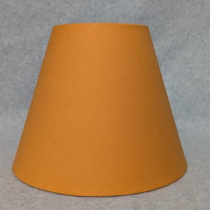 Caramel lamp shade.  Brown, orange. Gold.  Shade is 9.5&quot; wise at the bottom, 5&quot; wide at the top and 7&quot; tall