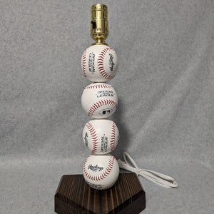 Baseball lamp. Made with real baseballs.  Can be personalized.  The Original and often imitated, never duplicated.