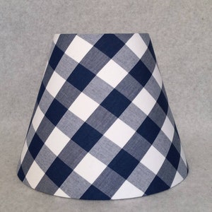 Navy blue Buffalo Check lamp shade.  1" squares.  Checkered.  Blue and white.  Shade is 9.5" wide at bottom, 5" wide at the top and 7" tall