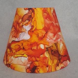 Orange, blender, molten, flower lamp shade.  Shade is 9.5 wide at the bottom, 5" wide at the top and 7" tall