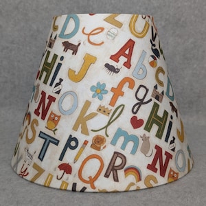 Alphabet lamp shade. Letters.  Shade is 9.5 wide at the bottom, 5&quot; wide at the top and 7&quot; tall