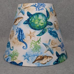 Seahorse and shells Ocean shade.  Beach life.   Starfish.  Shades are 9.5 x 5 x 7 tall
