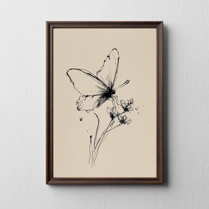 May include: A framed art print featuring a delicate black ink illustration of a butterfly perched on a flower. The artwork is set against a beige background and enclosed in a dark brown wooden frame, creating a classic aesthetic.