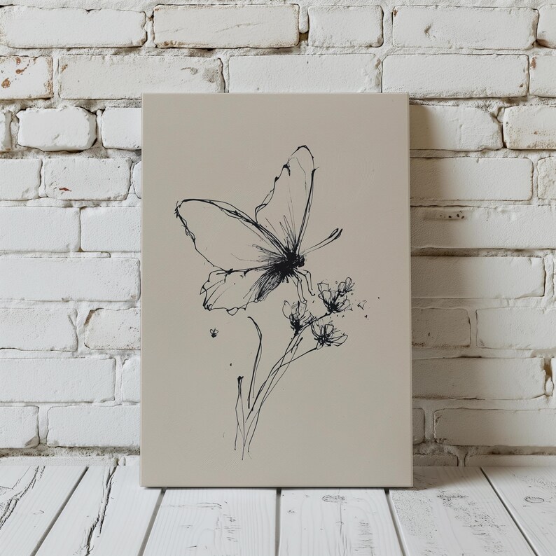 May include: A canvas art print featuring a black and white butterfly illustration. The butterfly is perched on delicate flowers, with fine lines and details. The artwork is set against a neutral background, creating a minimalist aesthetic.