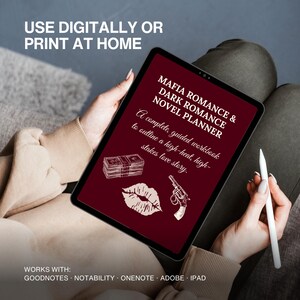 May include: A digital tablet with a dark red screen, featuring white text and illustrations. The text on the screen reads "MAFIA ROMANCE & DARK ROMANCE NOVEL PLANNER" and "A complete, guided workbook to outline a high-heat, high-stakes love story."