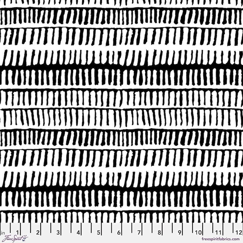 The image is a black and white striped pattern with a ruler for scale.