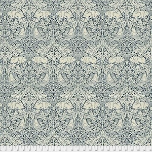 May include: Fabric with a repeating pattern of birds, rabbits, and foliage in dark blue and cream. The design is intricate and symmetrical, evoking traditional textile patterns. The pattern includes detailed depictions of nature elements.