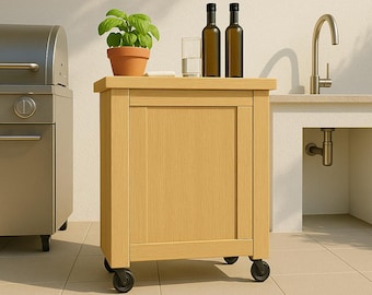 May include: A light-colored wooden outdoor cabinet on wheels. The cabinet has a flat top with a potted plant, two bottles, and a glass. A stainless steel grill is to the left. The cabinet is on a tiled surface.