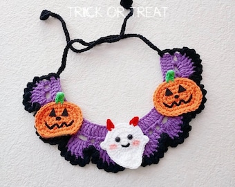 May include: Crocheted Halloween collar featuring orange pumpkins and a white ghost with red horns. The collar is purple with black trim and the text "HALLOWEEN TRICK OR TREAT" is at the top.