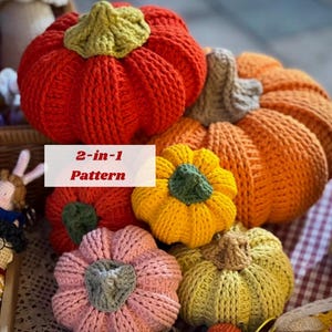 May include: A collection of handmade crochet pumpkins in various colors, including orange, red, yellow, and pink. Each pumpkin has a green or gray stem. The image includes the text "2-in-1 Pattern".