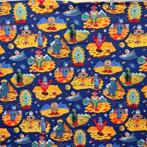 May include: A blue fabric with a repeating pattern of robots and spaceships. The robots are in various colors, including red, green, yellow, and blue. The spaceships are silver and have a retro design.