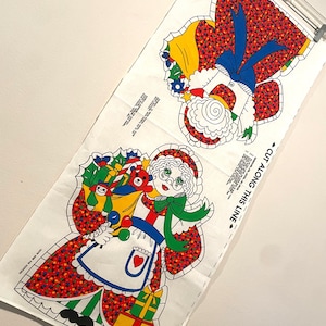 May include: A handmade wooden sign with the text "Welcome to our home" in a handwritten style. The sign is painted white with a dark stained wooden frame. The sign measures approximately 12 inches wide and 8 inches tall.