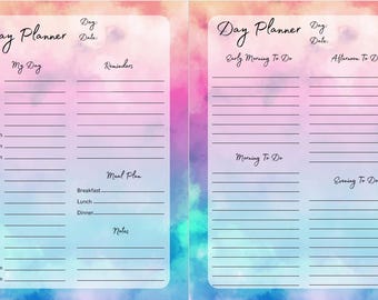 May include: A two-page day planner with a watercolor background in shades of pink, blue, and purple. The left page has a schedule from 5:00 am to 11:00 pm, reminders, and a meal plan. The right page has sections for early morning, afternoon, morning, and evening to-do lists.
