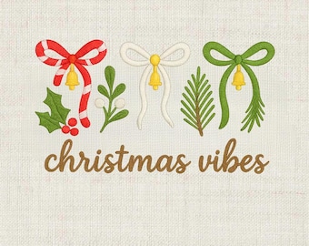 May include: Embroidered design with three bows in red and white, white, and green, each with a gold bell. Green holly and a sprig of white berries are included. The words "christmas vibes" are in brown script.