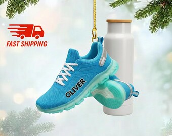 May include: A pair of turquoise athletic shoes with white laces and the name "OLIVER" printed on the side. The shoes have a light blue translucent sole and silver accents. A white water bottle with a bamboo lid is in the background.