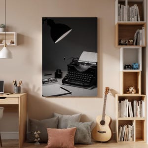May include: A black vintage typewriter with a paper sheet, ink bottle, and eyeglasses on a desk. A black desk lamp illuminates the scene. The image is in black and white.