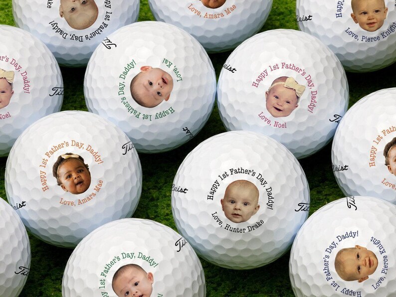 All available color options for 1st Fathers Day photo design are shown across multiple golf balls: Black, Blue, Green, Orange, Pink
