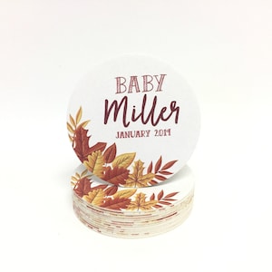 Custom design coasters featuring Baby Miller fall leaves design. Coasters are shown against a white background.