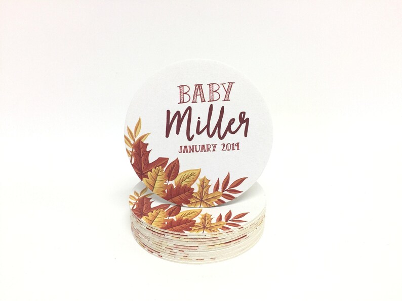 Custom design coasters featuring Baby Miller fall leaves design. Coasters are shown against a white background.