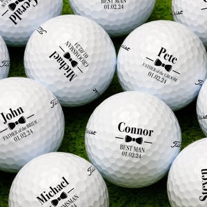 Multiple golf balls shown with Wedding Bowtie design in all available designs.