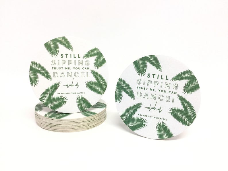 Custom design coasters featuring Still Sipping palm frond design. Coasters are shown against a white background.