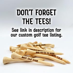 Don’t forget the tees! See link in description for our custom golf tee listing. A pile of golf tees are shown customized with different fonts and text.