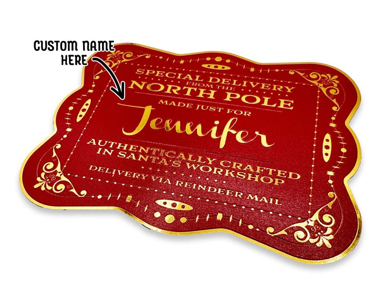 A gold foil cardstock Santa gift tag is shown on a white surface. The text above it reads, Custom Name Here.
