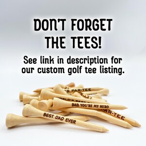 Don’t forget the tees! See link in description for our custom golf tee listing. A pile of golf tees are shown customized with different fonts and text.