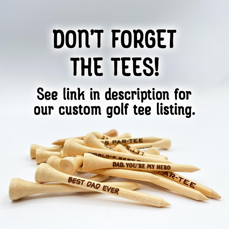 Don’t forget the tees! See link in description for our custom golf tee listing. A pile of golf tees are shown customized with different fonts and text.