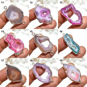May include: Nine agate pendants in assorted colours, such as pink, purple, blue, and brown. Each pendant has an irregular shape, a silver-coloured metal border, and two loops for attaching to a chain or other jewellery component.