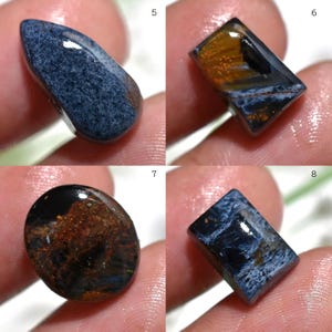 May include: Four polished gemstones in various shapes. The stones display a mix of colors, including deep blues, browns, and golds. Each stone has unique patterns and textures, showcasing natural variations. Ideal for jewelry making or collecting.