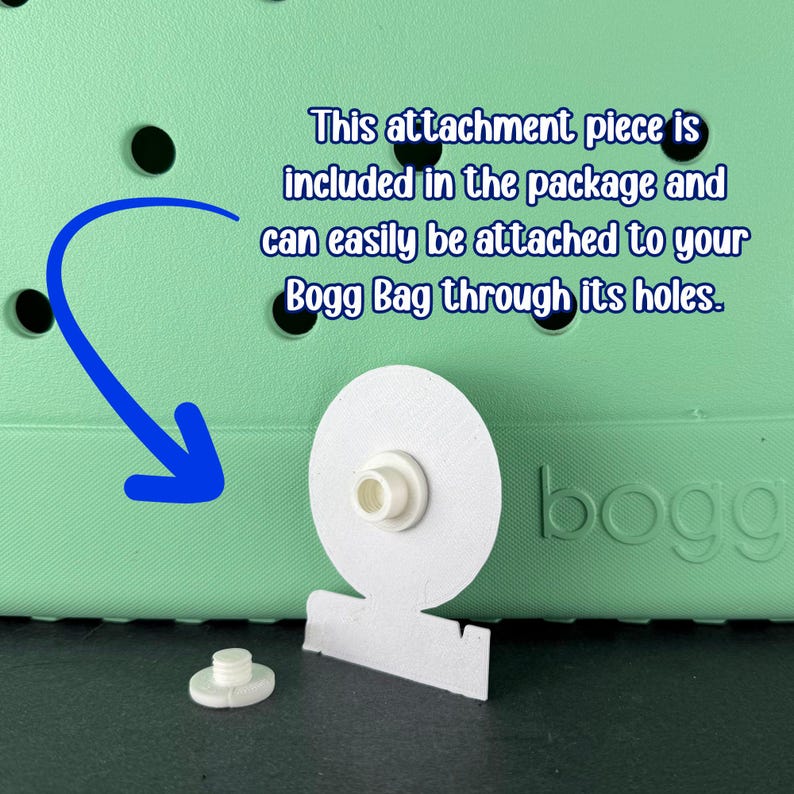 May include: White attachment piece for a Bogg Bag, with a circular design and a small, cylindrical post. The image shows the attachment piece next to a Bogg Bag, with text indicating how to attach it.
