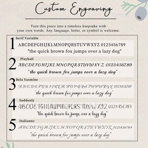 May include: A custom engraving font guide featuring five distinct typeface options labeled 1 through 5. Each option displays the full alphabet, numbers 0-9, and the phrase 'the quick brown fox jumps over a lazy dog' in Serif Variable, Playball, Bela Yasmine, Suddenly, and Italianno styles.