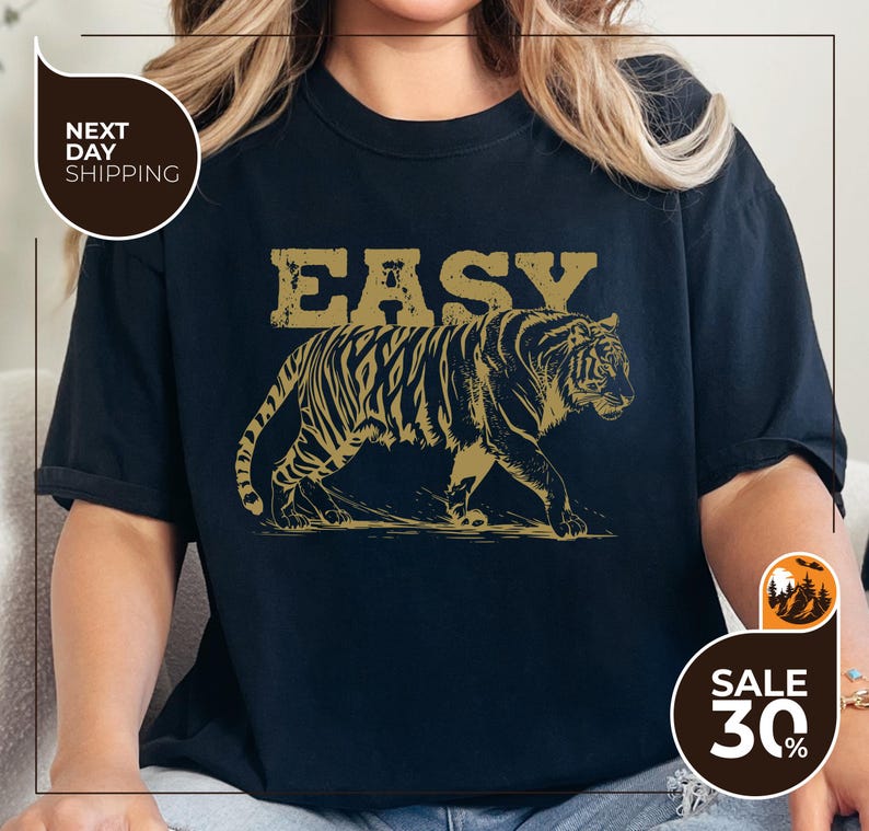 a woman wearing a t - shirt with a tiger on it