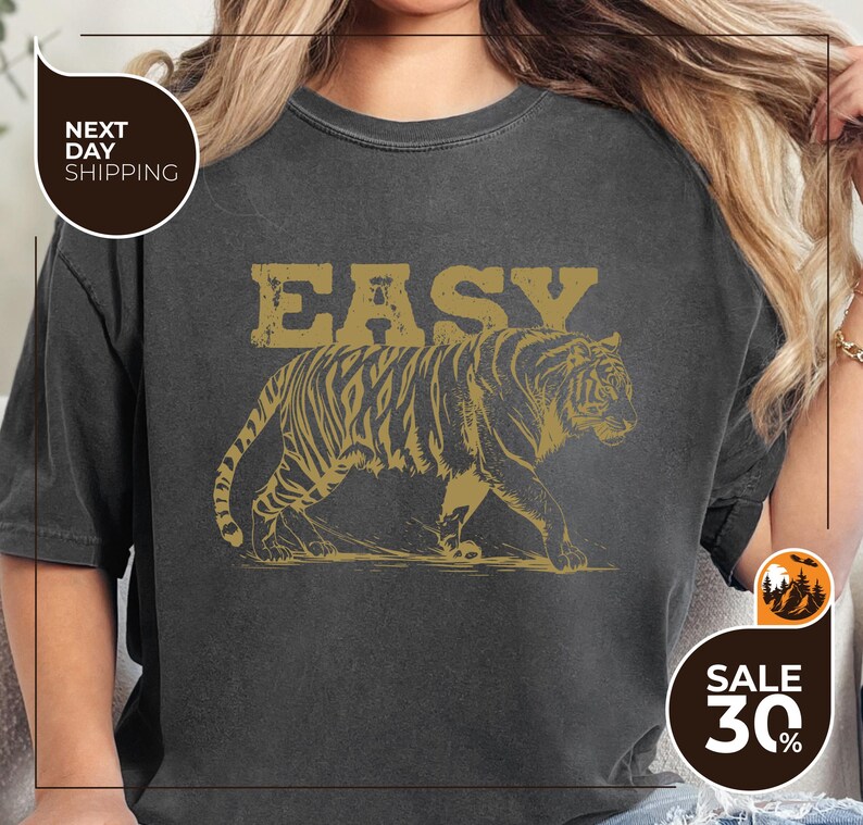 a woman wearing an easy tiger t - shirt