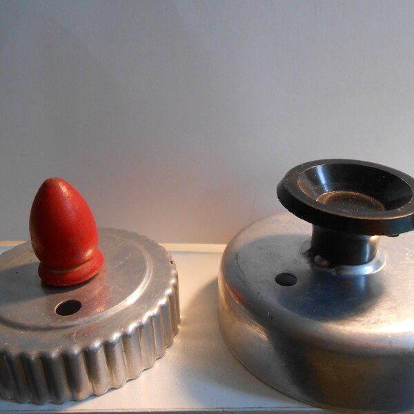 2 vintage biscuit cutters.......H