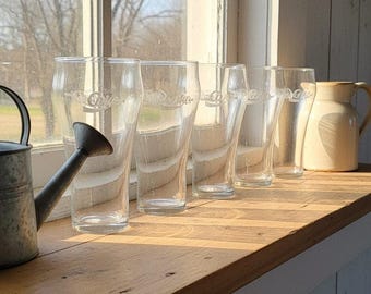 Zestaw 5 zabytkowych butelek Coca-Coli Enjoy Coca-Cola w kształcie dzwonka